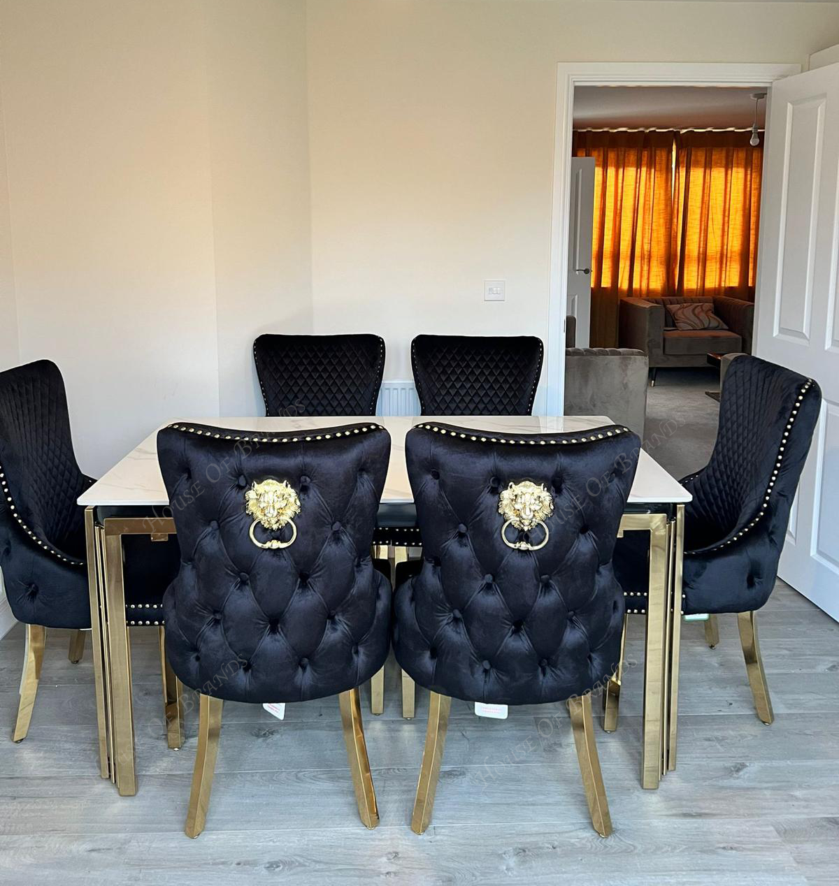 150cm Sorrento Rectangle Gold Ceramic Dining Table & Black and Gold Victoria Knockerback Dining Chairs