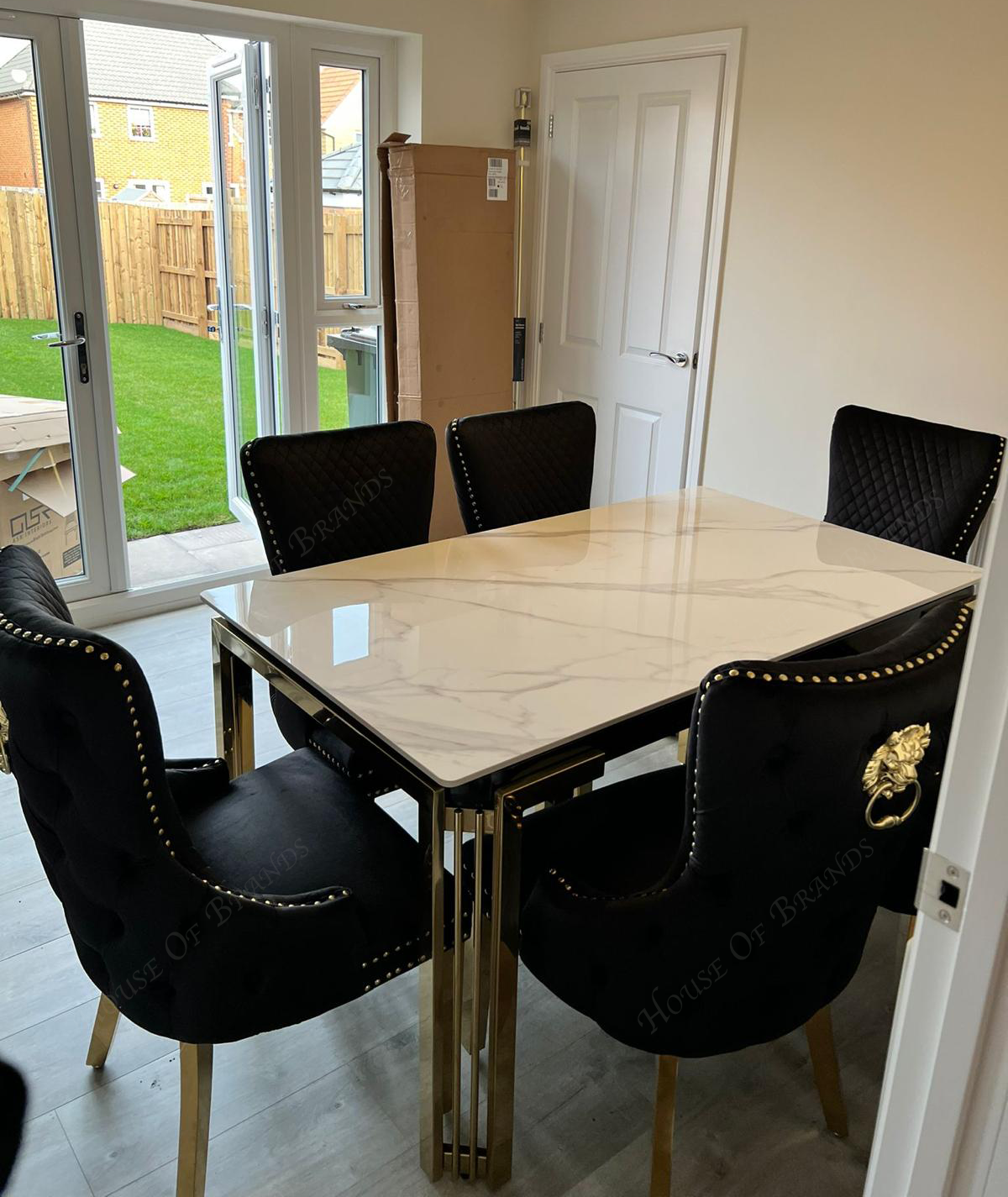 150cm Sorrento Rectangle Gold Ceramic Dining Table & Black and Gold Victoria Knockerback Dining Chairs