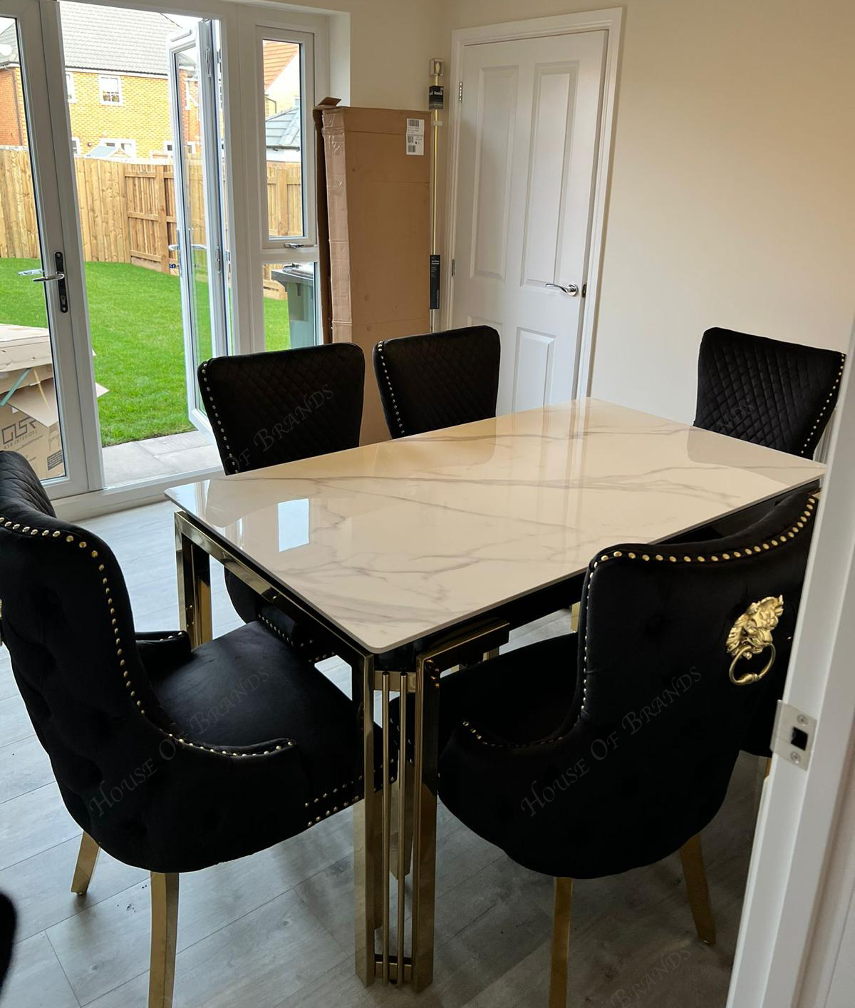 150cm Sorrento Rectangle Gold Ceramic Dining Table & Black and Gold Victoria Knockerback Dining Chairs