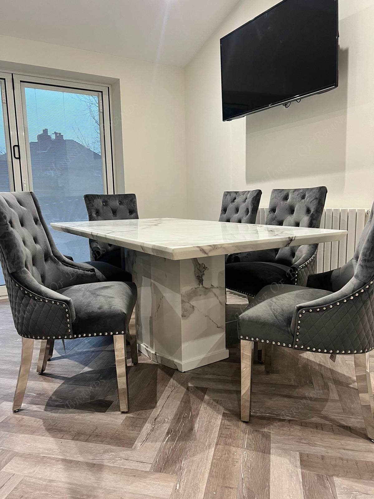 Naples White Marble Dining Table with Majestic Velvet Knockerback Dining Chairs